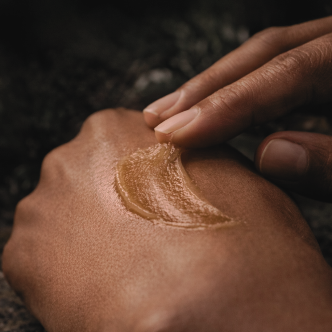 Six-Seed balm on the palm of a hand